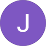 A solid purple circle featuring a large white capital letter J in the center.